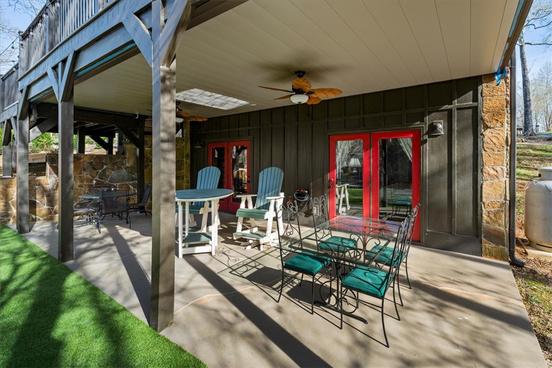 109 Carolina Cove Road Seneca, SC 29672 - Photo 37 of 45 This patio stays protected with new under decking & downspouts installed