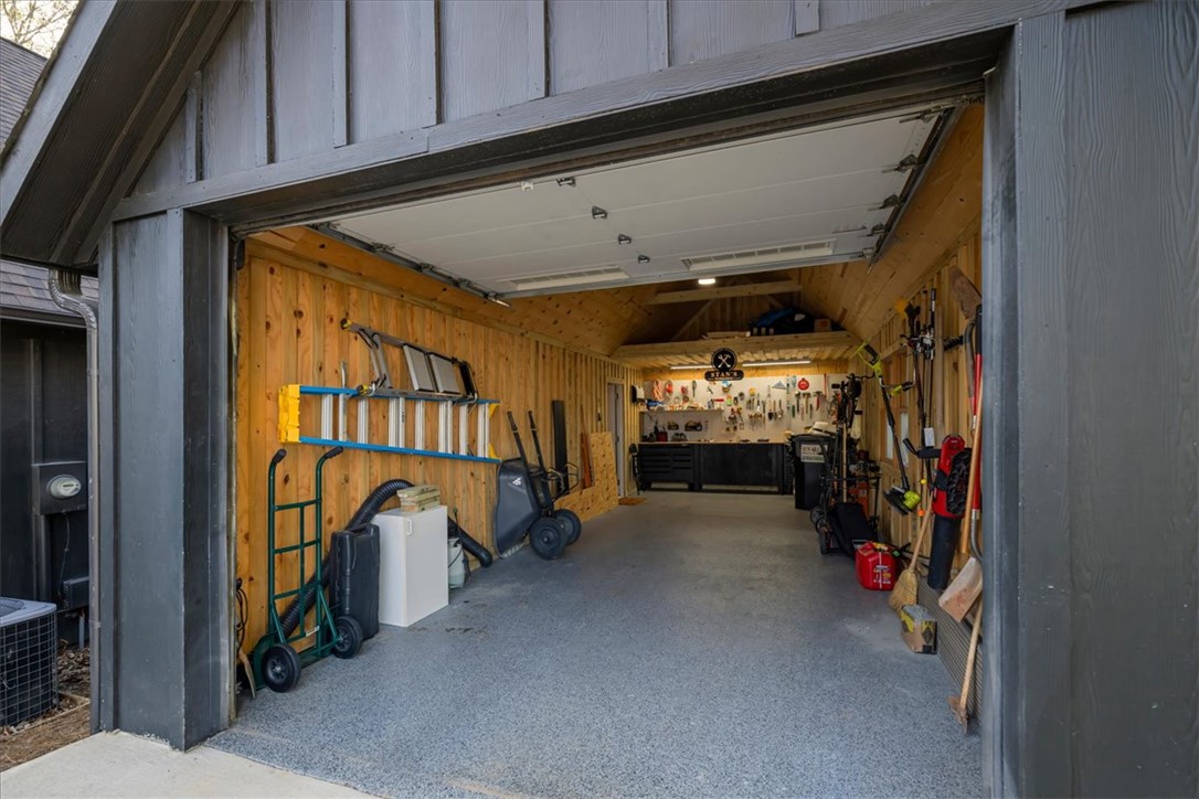 109 Carolina Cove Road Seneca, SC 29672 - Photo 38 of 45 This versatile garage offers storage for vehicle, golf cart, and a dedicated workshop area.