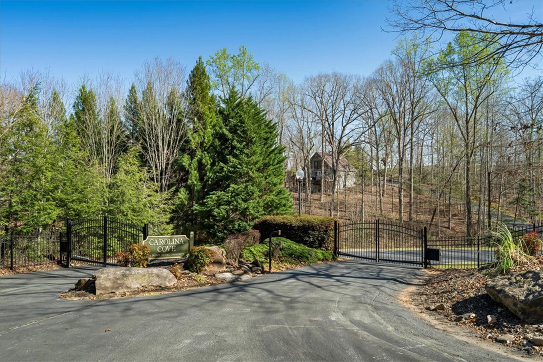109 Carolina Cove Road Seneca, SC 29672 - Photo 45 of 45 Carolina Cove is a secure community with an elegant wrought iron gate entrance. It consists of 9 lots with only 7 homes and $500 annual HOA.