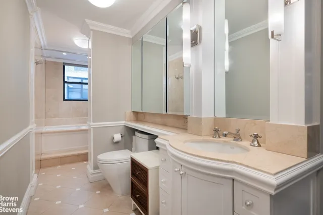 a bedroom with a large bed and a flat screen tv