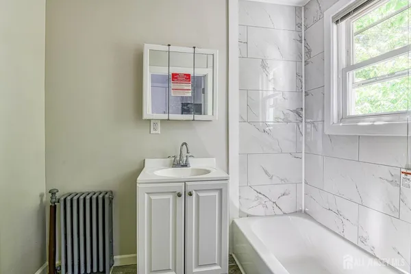 a bathroom with a sink and a bathtub
