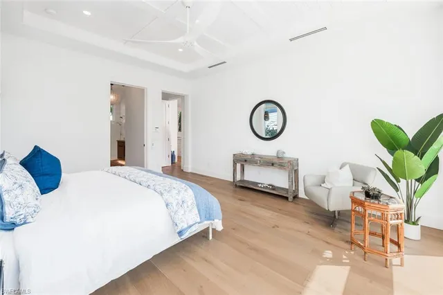 a spacious bathroom with a double vanity sink and a mirror