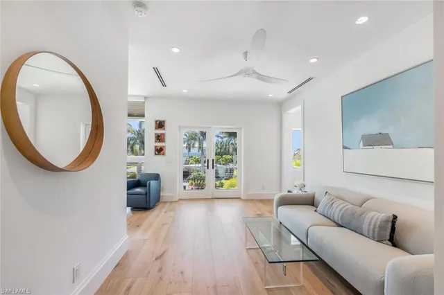 a living room with furniture window and fireplace