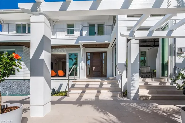 a view of a building with a door and a porch