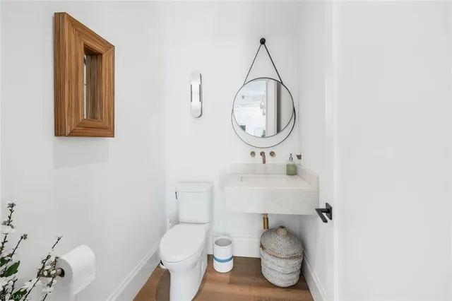 a bedroom with a bed a flat screen tv and balcony view