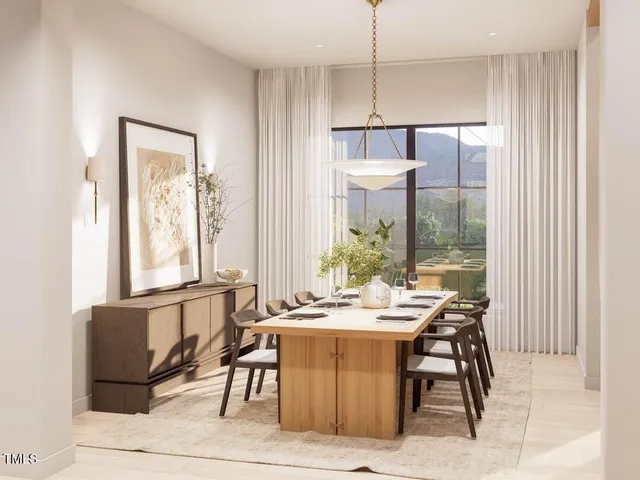 a spacious bedroom with a large bed and a large window