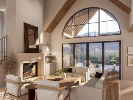 a living room with furniture a fireplace and a floor to ceiling window