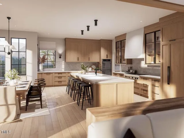 a kitchen with cabinets and chairs