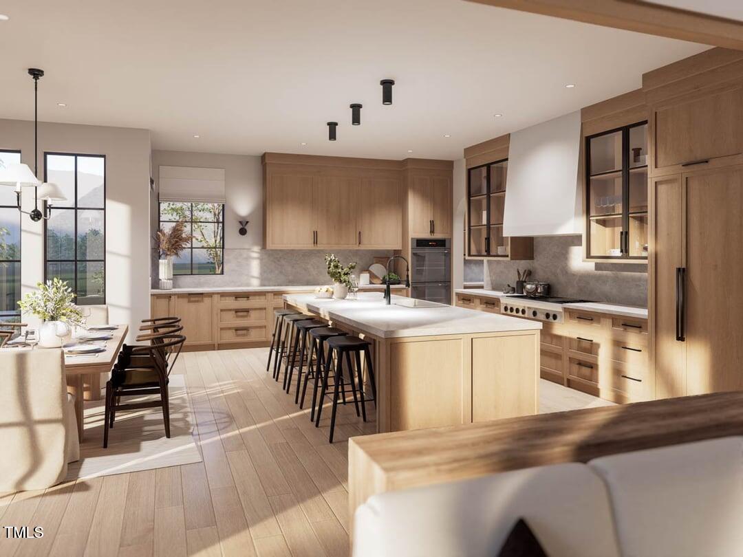 8016 Penny Road Raleigh, NC 27606 - Photo 8 of 23 a kitchen with stainless steel appliances kitchen island granite countertop a sink and cabinets