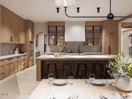 a view of a dining room and livingroom with furniture wooden floor a chandelier