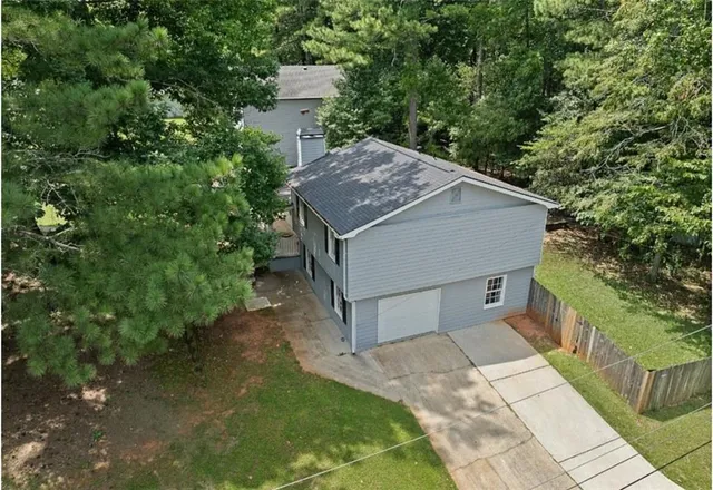 a house with trees in front of it