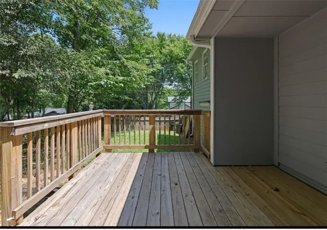 a view of balcony with wooden floor