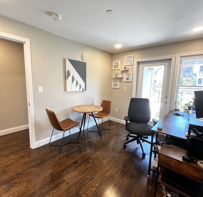 229 Maverick Street, Unit 1 Boston, MA 02128 - Photo 13 of 20 a workspace with furniture and wooden floor