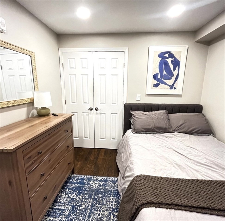 229 Maverick Street, Unit 1 Boston, MA 02128 - Photo 16 of 20 a bedroom with a bed and a window