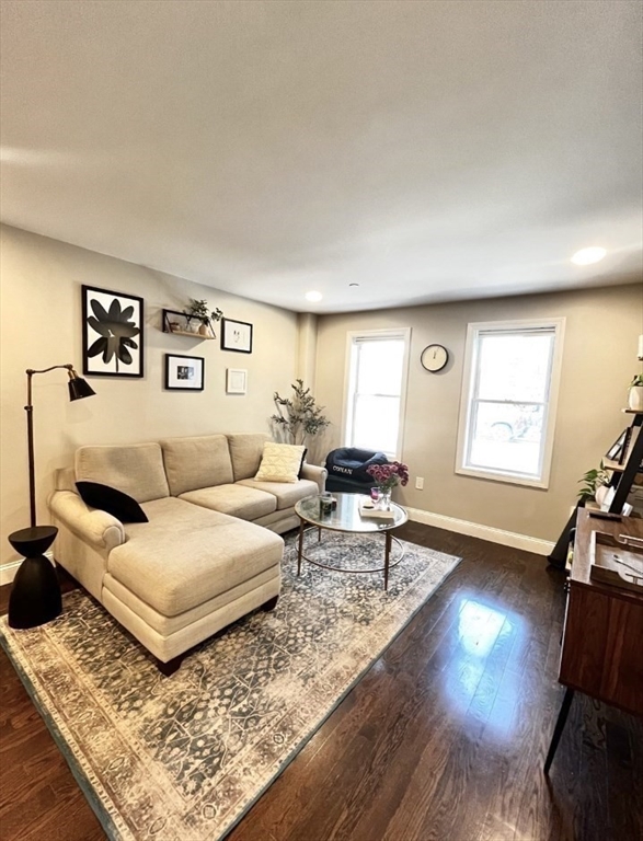 229 Maverick Street, Unit 1 Boston, MA 02128 - Photo 8 of 20 a living room with furniture and a flat screen tv