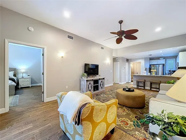 a bedroom with a bed a couch and a window