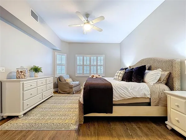 a bedroom with a bed and a couch