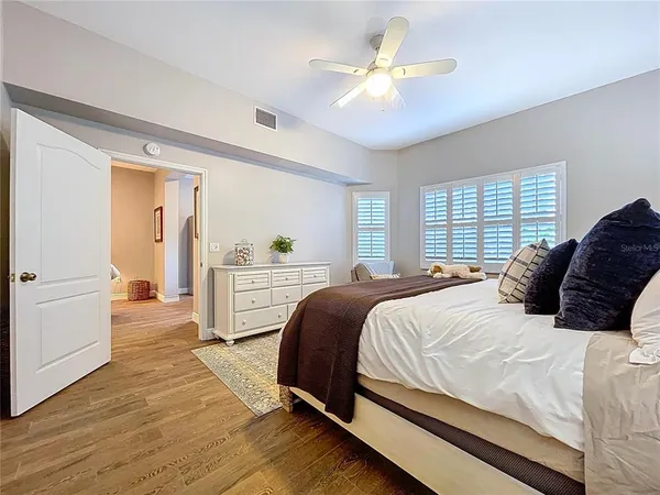 a bathroom with a bathtub a double vanity sink and mirror