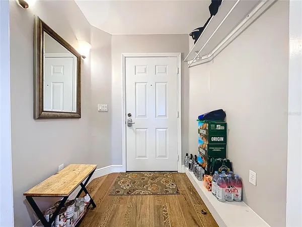 a kitchen with kitchen island granite countertop a sink and refrigerator