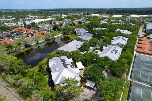 an aerial view of residential houses with outdoor space
