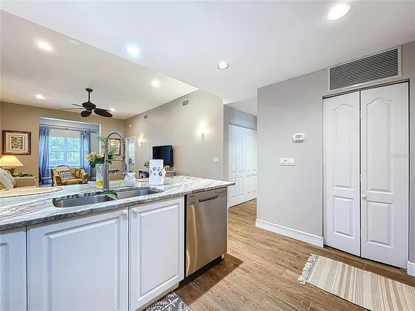 a kitchen with a refrigerator and a sink