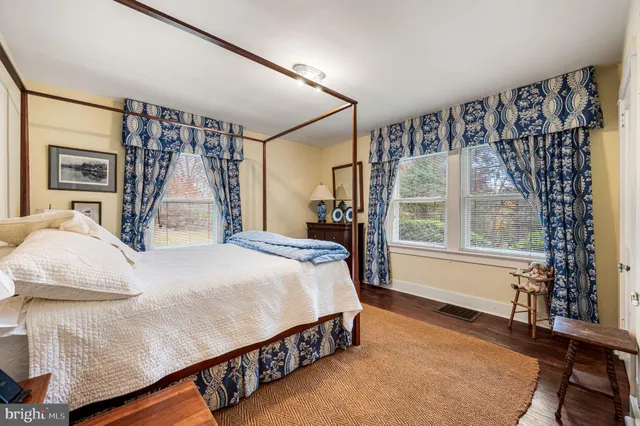 a bedroom with furniture and a window