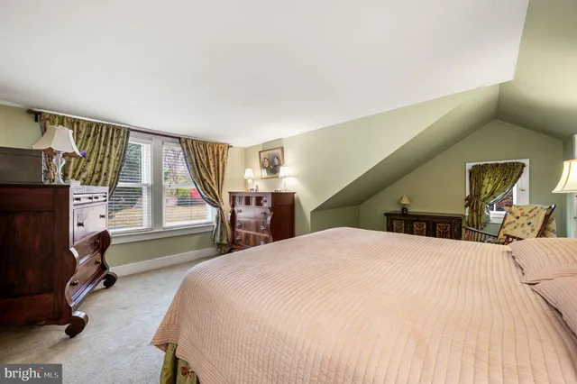 a bedroom with a bed and cabinets