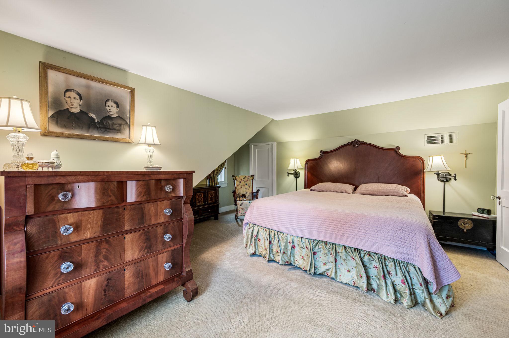 1033 Lenape Road West Chester, PA 19382 - Photo 17 of 33 a bedroom with a bed and cabinets