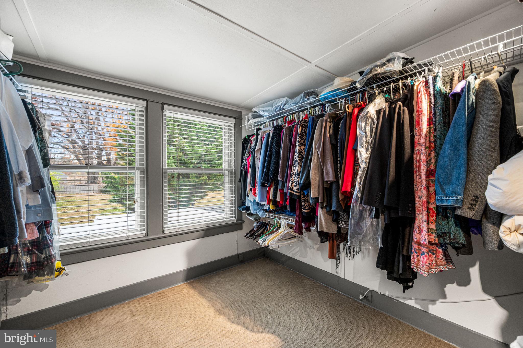 1033 Lenape Road West Chester, PA 19382 - Photo 19 of 33 a view of walk in closet with clothes and shoes
