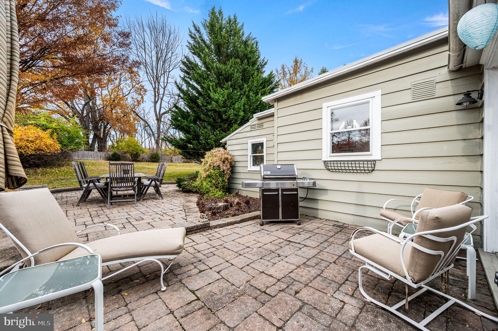 1033 Lenape Road West Chester, PA 19382 - Photo 21 of 33 a view of a patio with a dining table and chairs with wooden floor