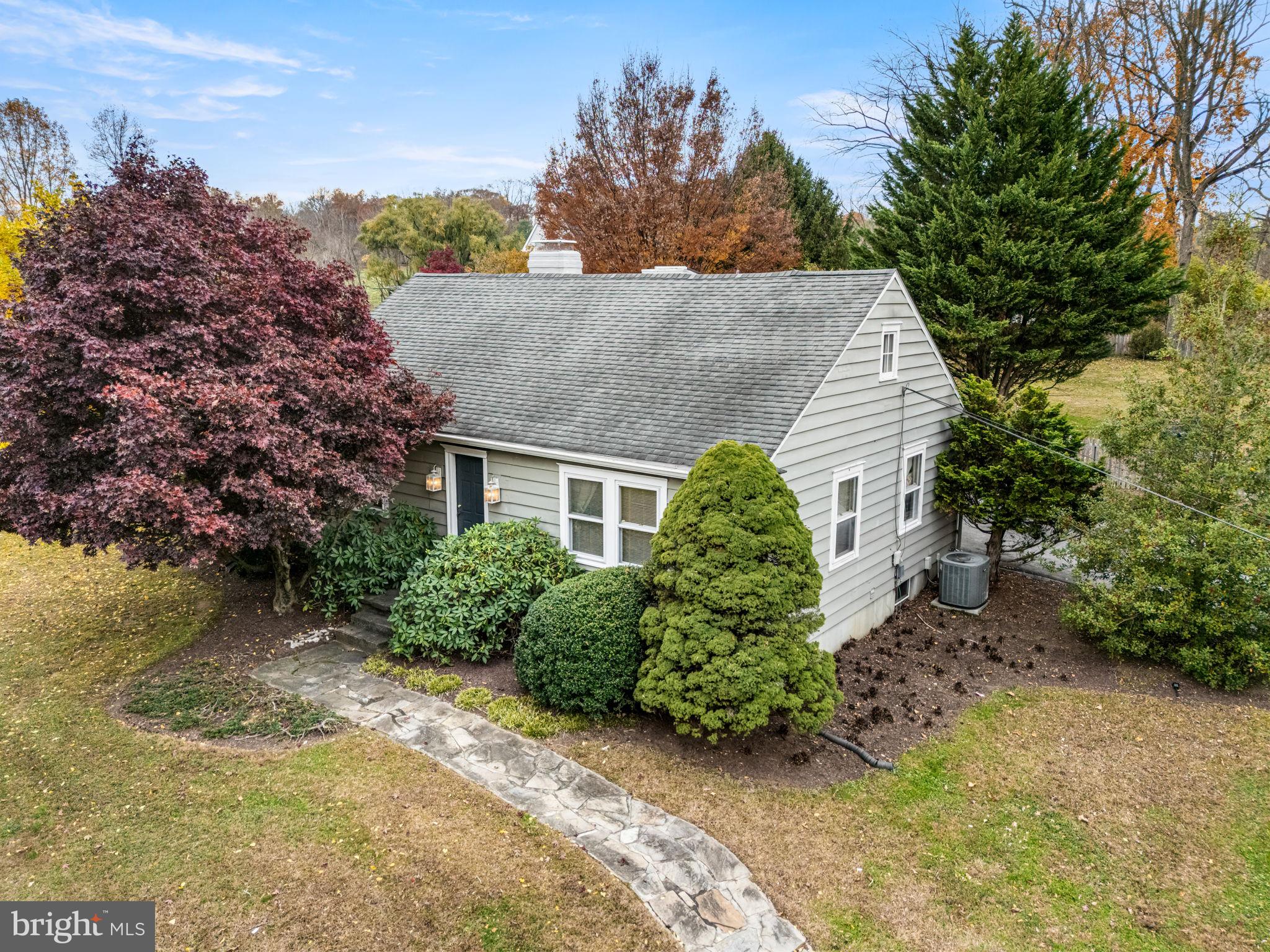 1033 Lenape Road West Chester, PA 19382 - Photo 24 of 33 a view of a house with a yard and garage