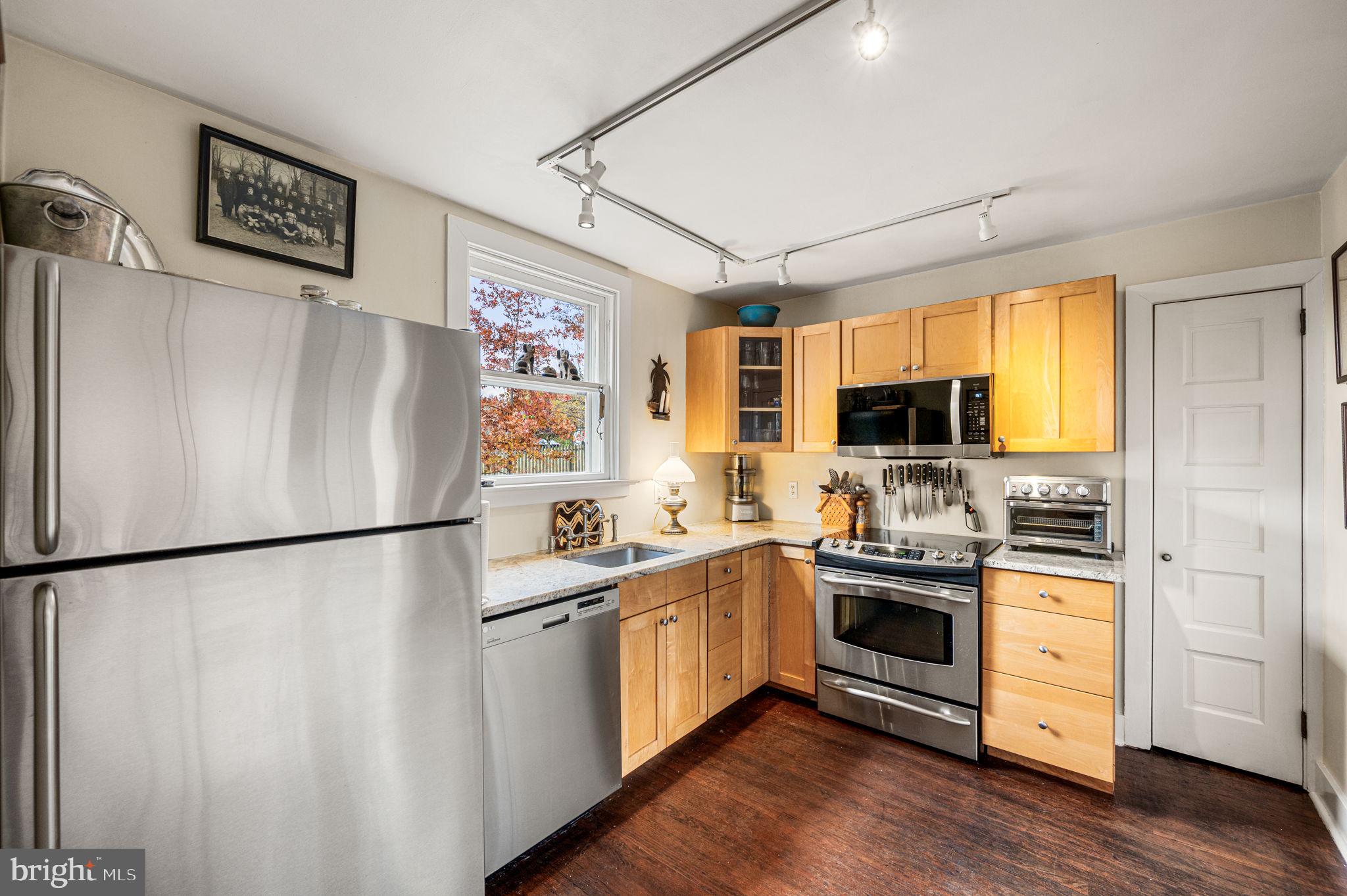 1033 Lenape Road West Chester, PA 19382 - Photo 9 of 33 a kitchen with stainless steel appliances a refrigerator sink and microwave