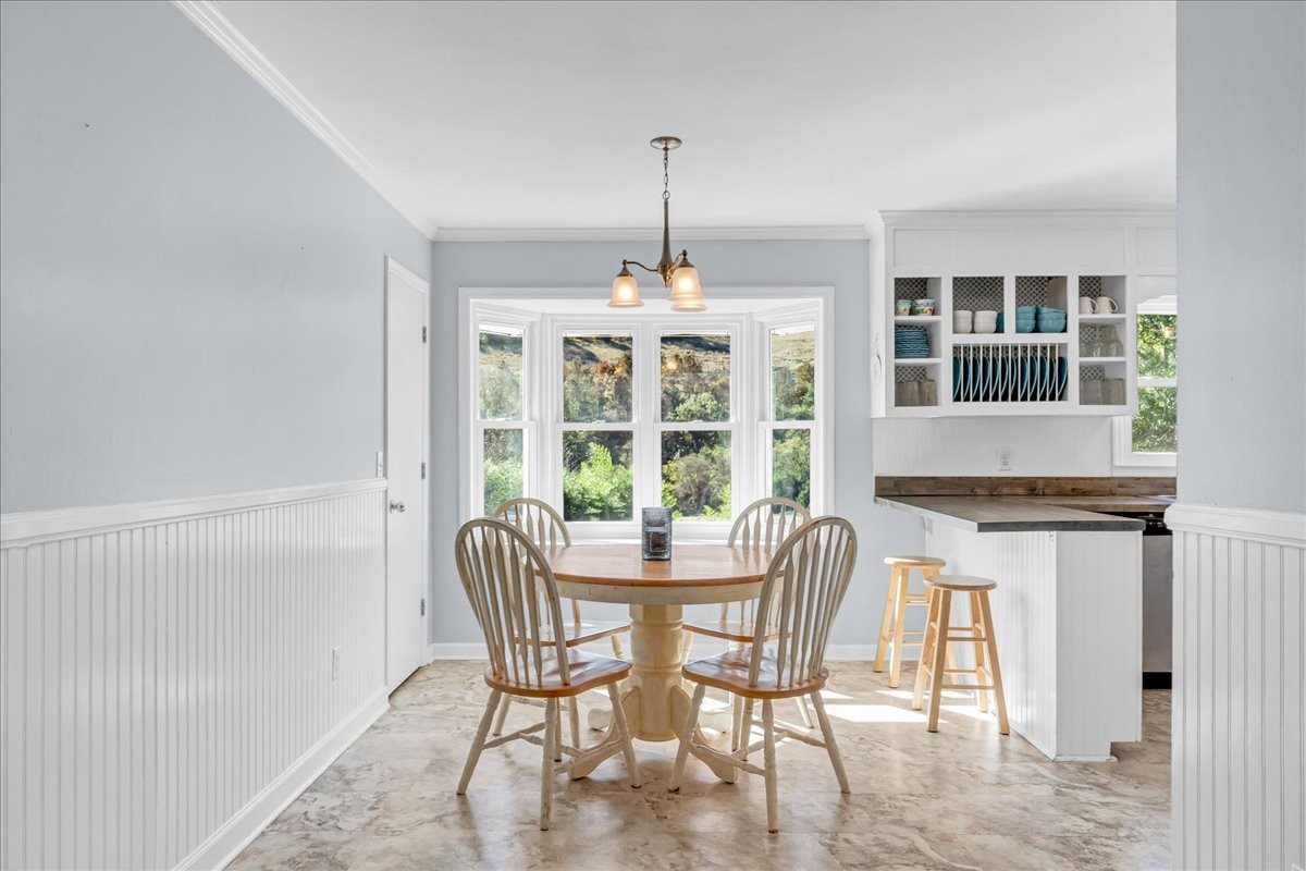 487 County Line Road Lynchburg, TN 37352 - Photo 11 of 63 a dining room with furniture a chandelier and wooden floor