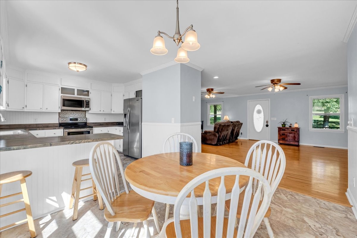 487 County Line Road Lynchburg, TN 37352 - Photo 13 of 63 a view of a dining room with furniture and wooden floor