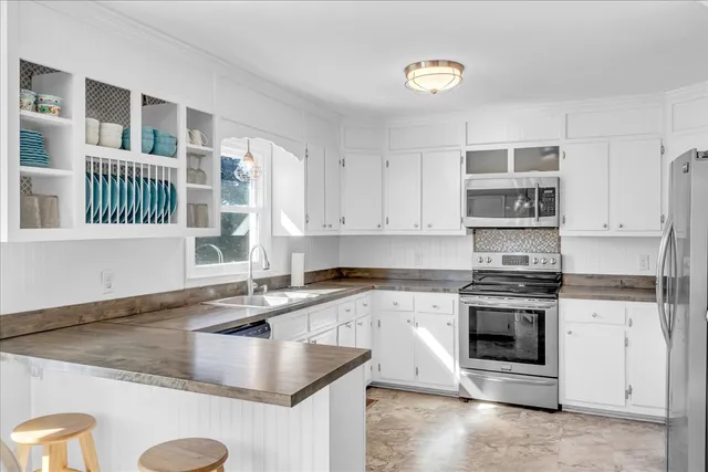 a kitchen with a stove and a sink