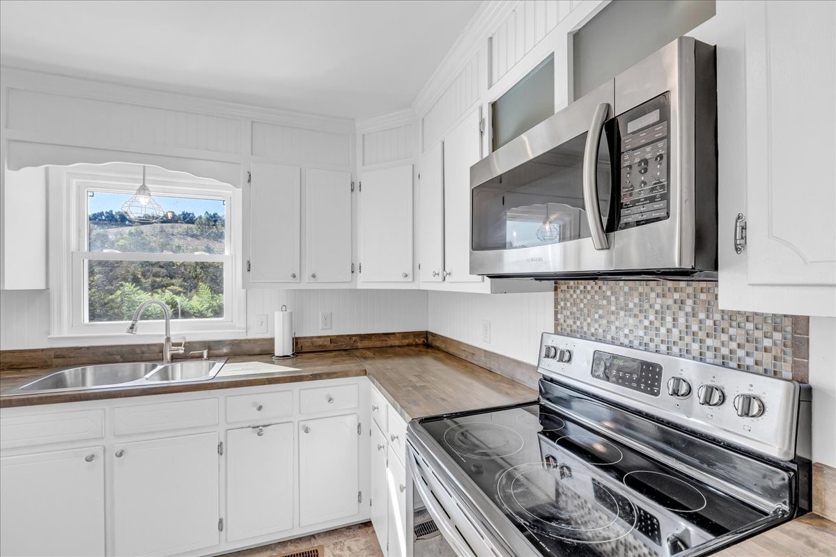 487 County Line Road Lynchburg, TN 37352 - Photo 19 of 63 a kitchen with a stove and a sink