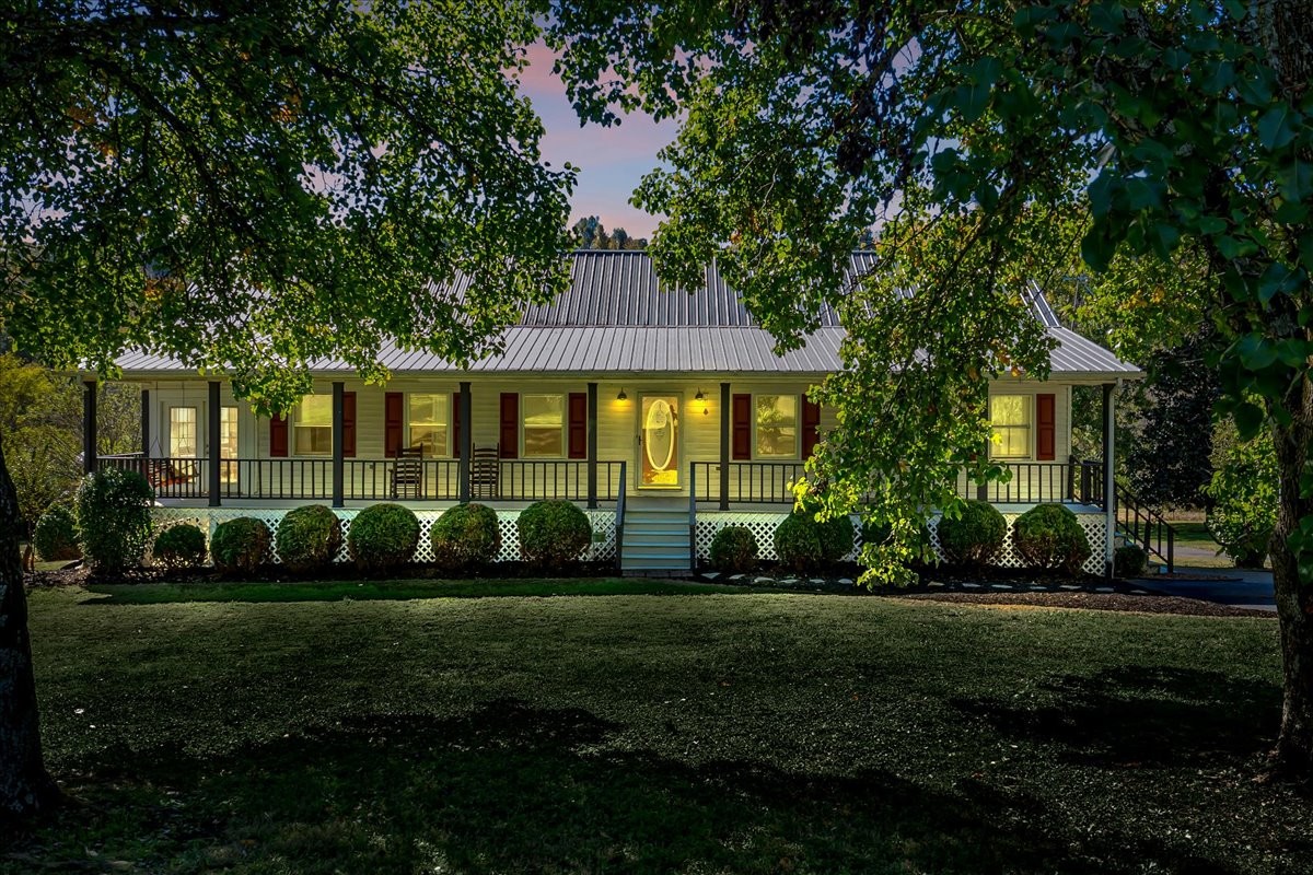 487 County Line Road Lynchburg, TN 37352 - Photo 2 of 63 a front view of a house with a garden