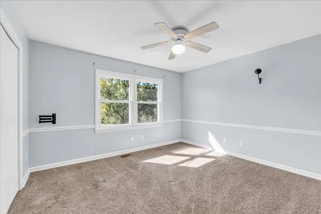 a bathroom with a sink toilet and shower curtain