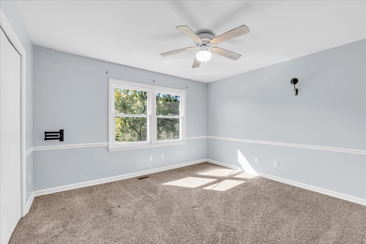 487 County Line Road Lynchburg, TN 37352 - Photo 24 of 63 a view of a big room with windows and chandelier fan
