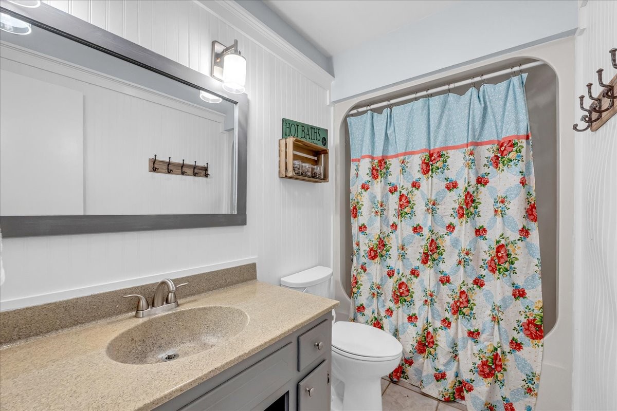 487 County Line Road Lynchburg, TN 37352 - Photo 26 of 63 a bathroom with a sink toilet and shower curtain