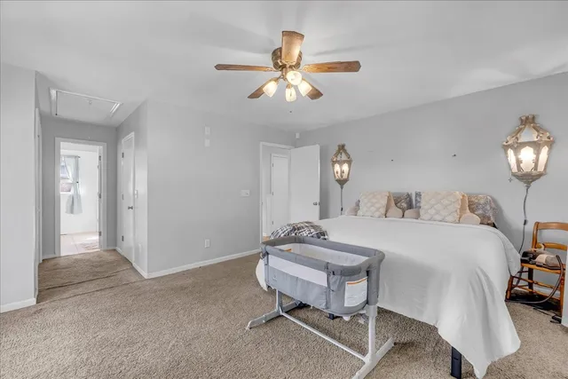 a bed room with a bed and a window