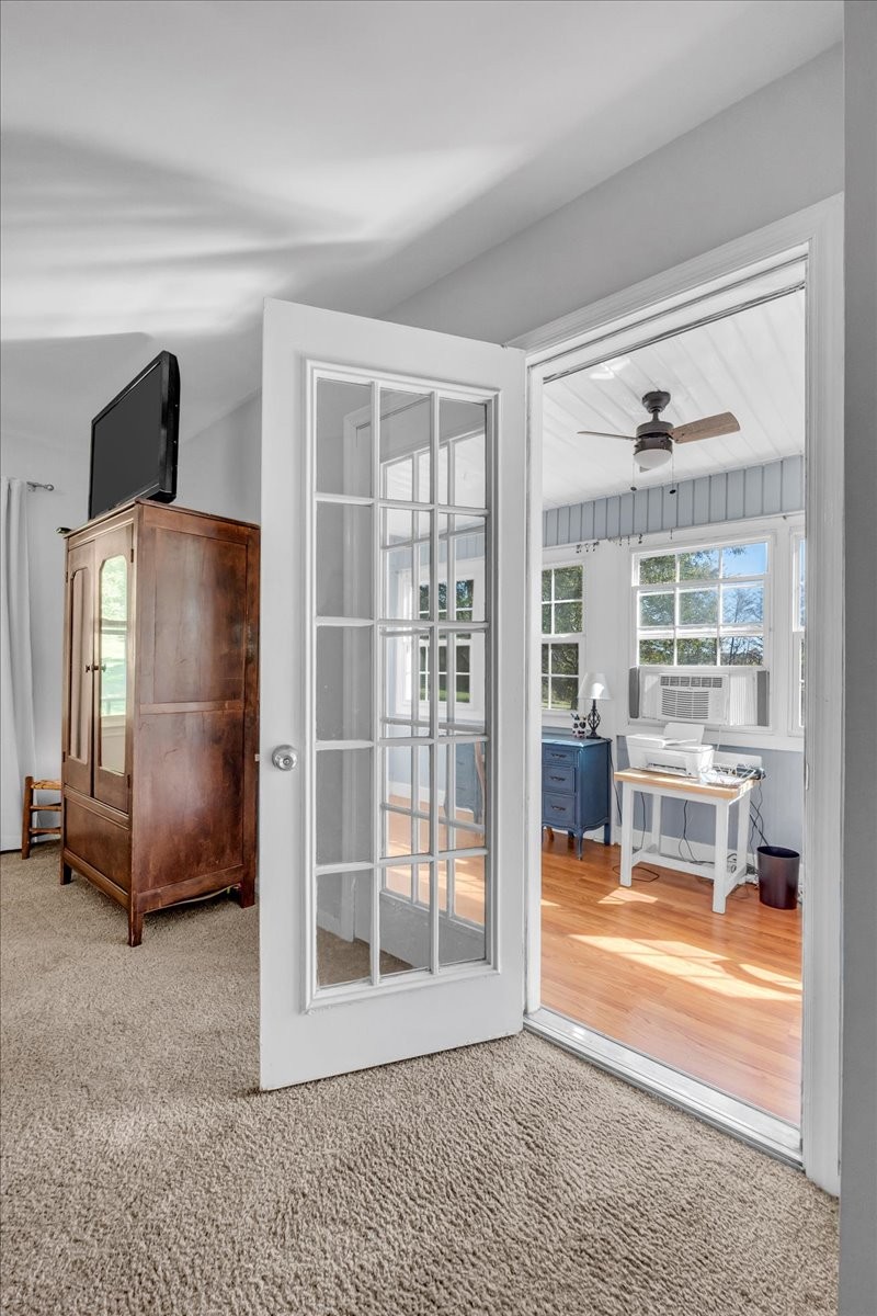 487 County Line Road Lynchburg, TN 37352 - Photo 35 of 63 a view of a livingroom with furniture a ceiling fan and window