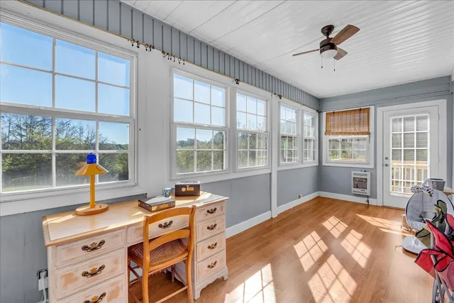 a view of a balcony with wooden floor