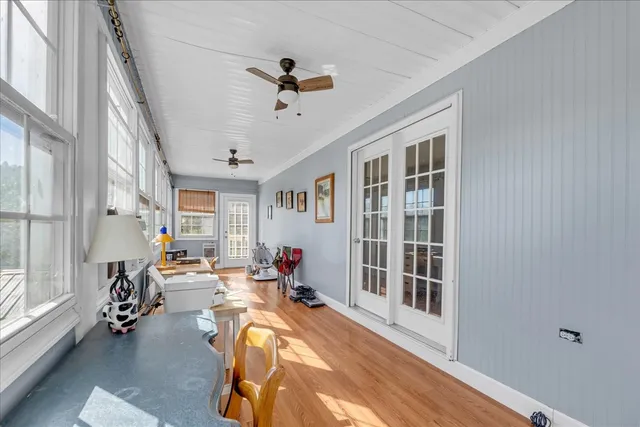 a view of a balcony with wooden floor