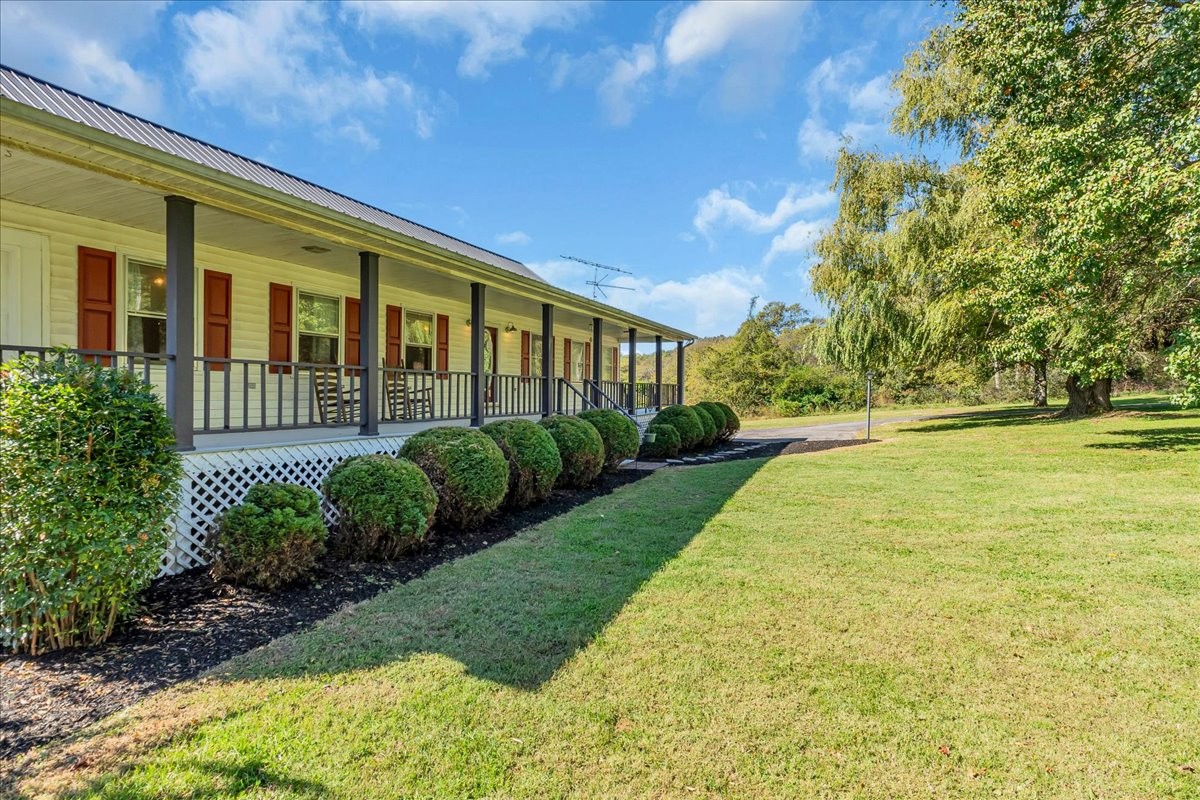 487 County Line Road Lynchburg, TN 37352 - Photo 6 of 63 a front view of a house with a yard