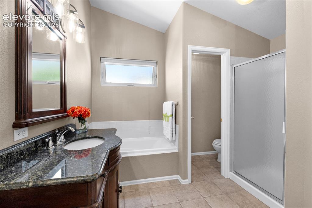 7840 Midnight Road Peyton, CO 80831 - Photo 23 of 48 A sep soaking tub and shower along with beautiful "furniture" style counter is a delight