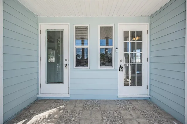 a view of a pathway with a flower garden