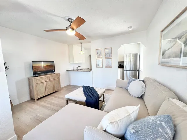 a view of washer and dryer with wooden floor