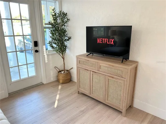 a kitchen with a stove microwave and sink