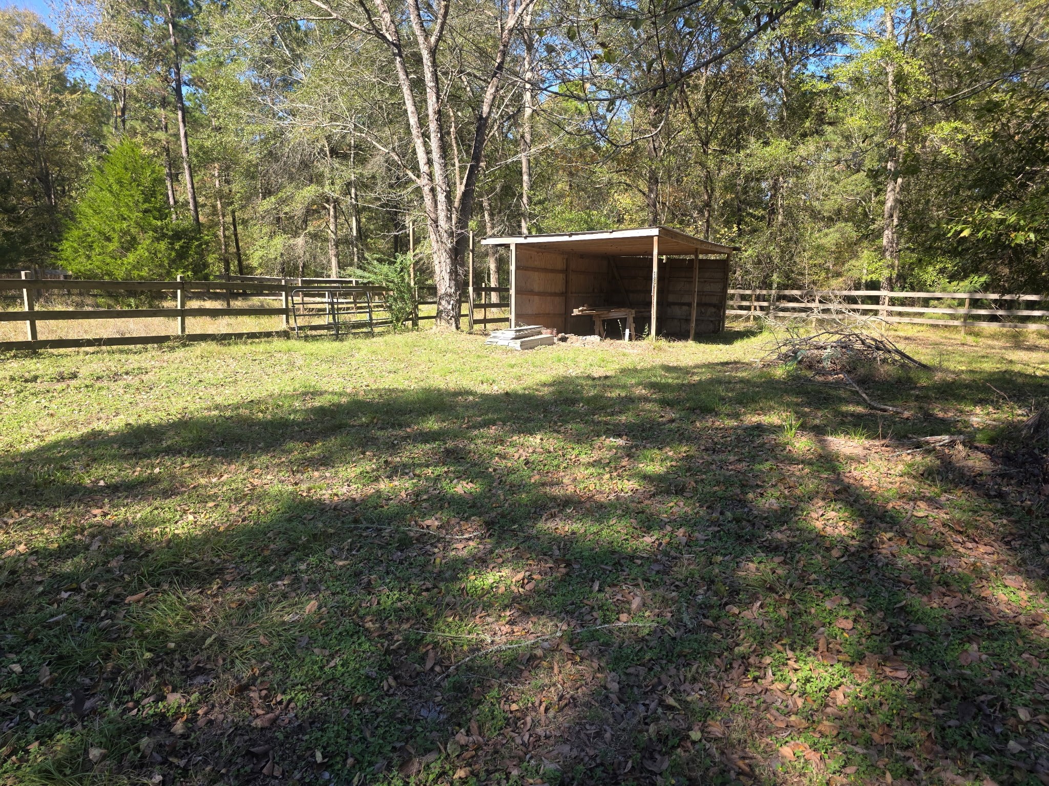 633 Ira Denson Road Coldspring, TX 77331 - Photo 9 of 27 a view of a house with a yard